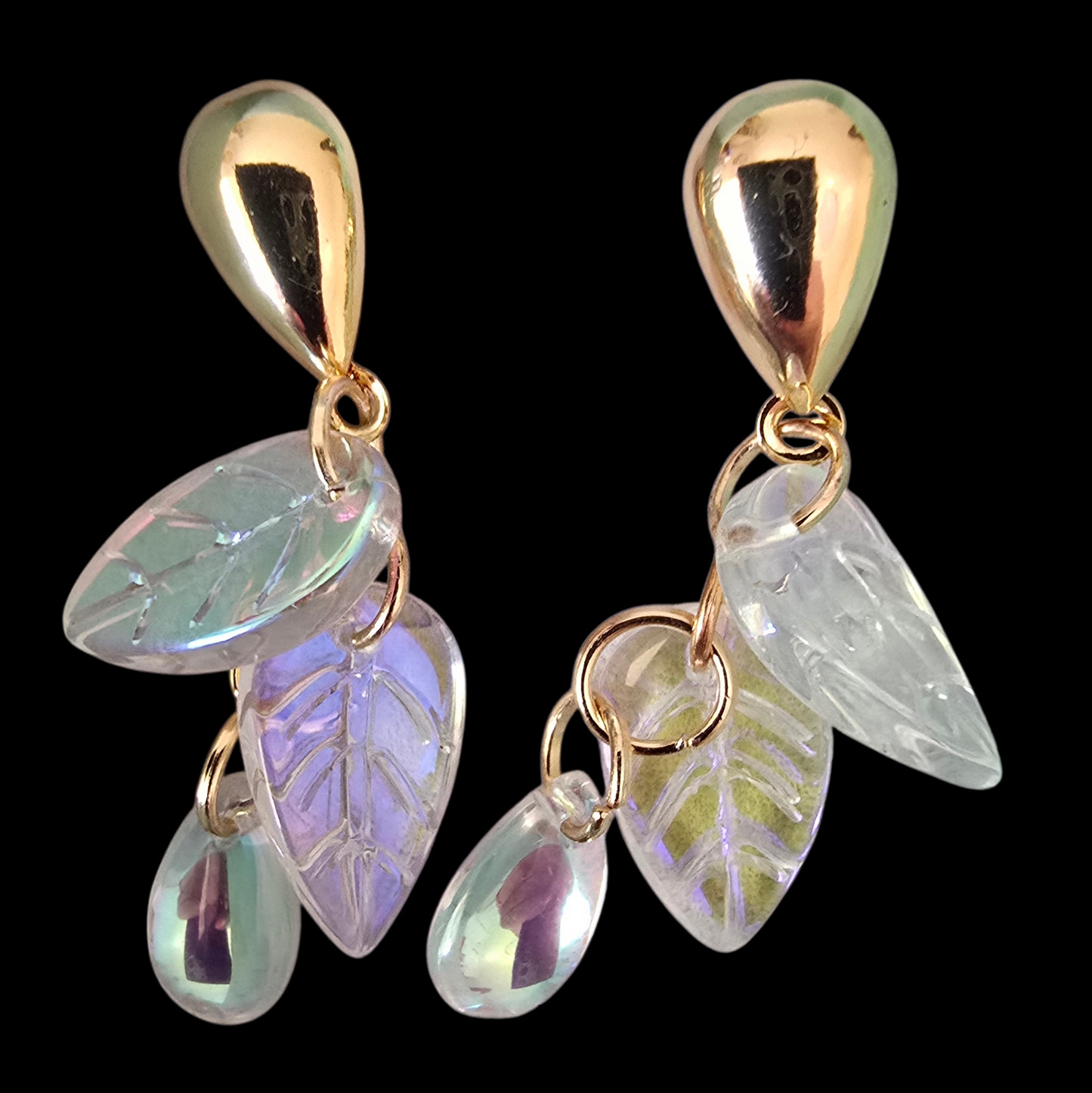 Earrings dangling studs shimmering leaves